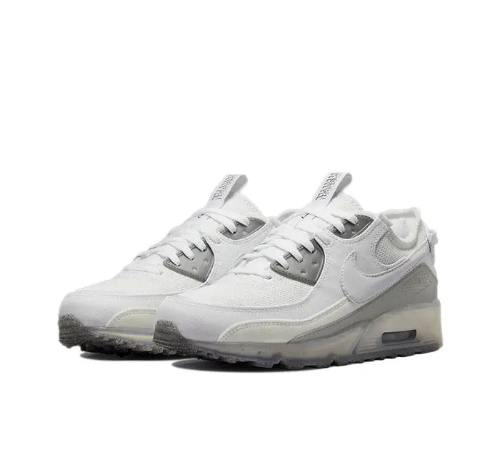Air Max 90 side view sneaker in white with gray overlays and air sole