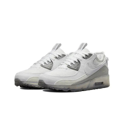 Air Max 90 side view sneaker in white with gray overlays and air sole