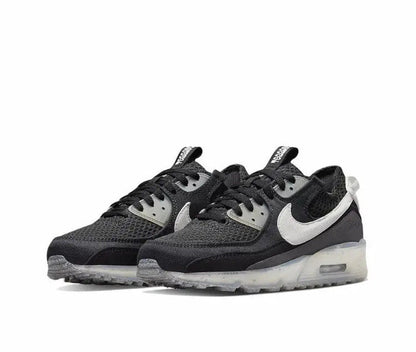 Nike Air Max 90 sneaker, front view with black mesh and white trim