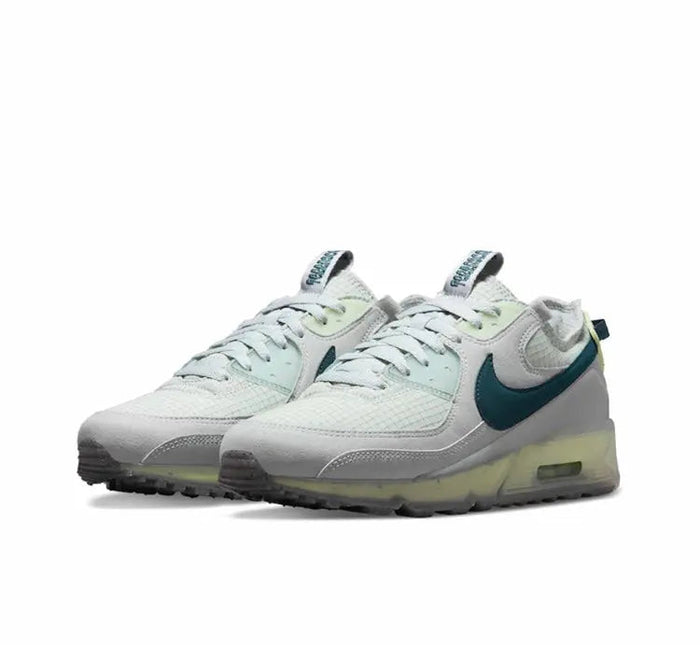 Air Max 90 sneakers pair, white mesh with teal swoosh and lime-tinted sole