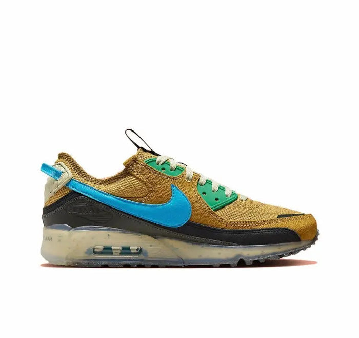 Air Max 90 sneaker in wheat gold with blue swoosh and green accents, side profile