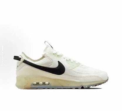 Nike Air Max 90 sneaker side profile, pale white leather with black swoosh and Air unit