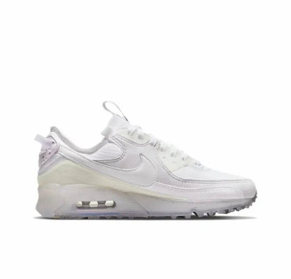 Air Max 90 sneakers, white side profile with Air unit under heel and laces.