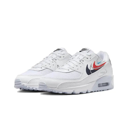 Nike Air Max 90 sneakers, white upper with navy Swoosh and red/blue accents