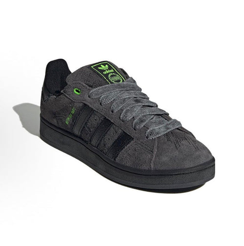 Black suede Adidas Campus sneakers with green logo accents and lace-up front