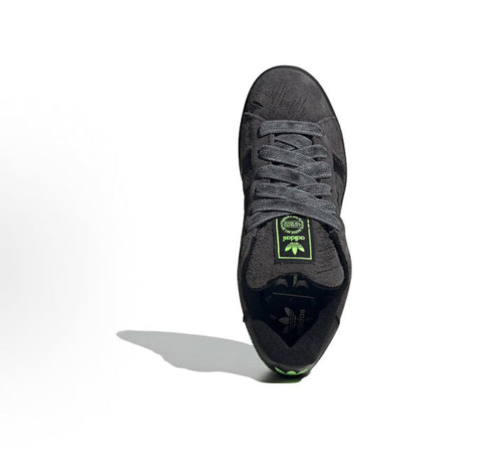 Black lace-up Adidas Campus sneaker with green tongue patch and textured upper