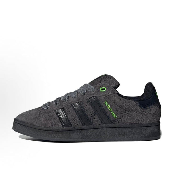 Black Adidas Campus sneaker with green heel and tongue details, low-profile design