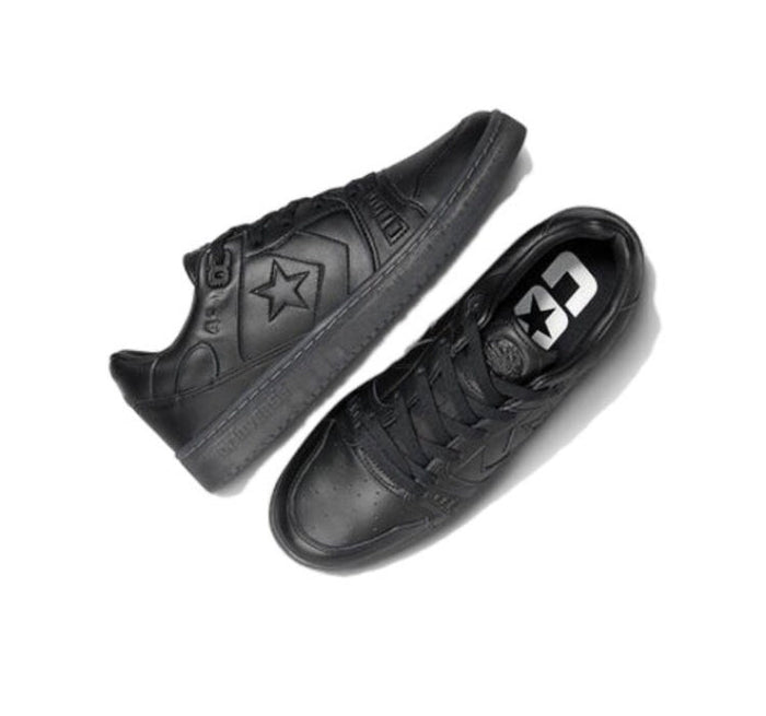 Black low-top sneakers shown from side, lace-up with star emblem on the quarter