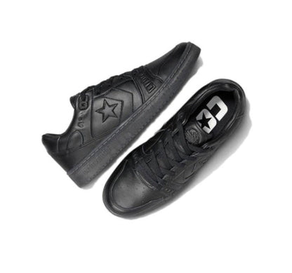 Black low-top sneakers shown from side, lace-up with star emblem on the quarter