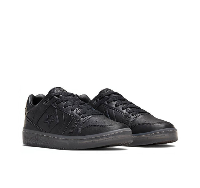 Black low-top sneakers pair view, lace-up with embossed star details