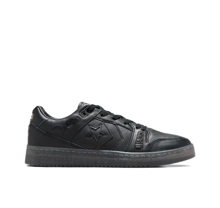 Black low-top sneakers side view, lace-up with star panel and rubber cupsole