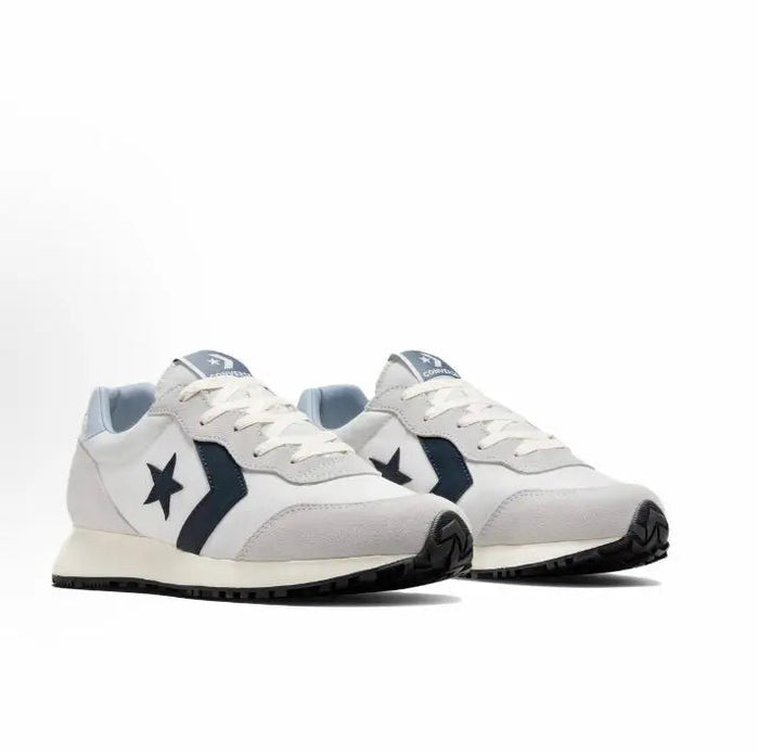 Pair of low-top lace-up sneakers with grey uppers, navy accents, and star logos