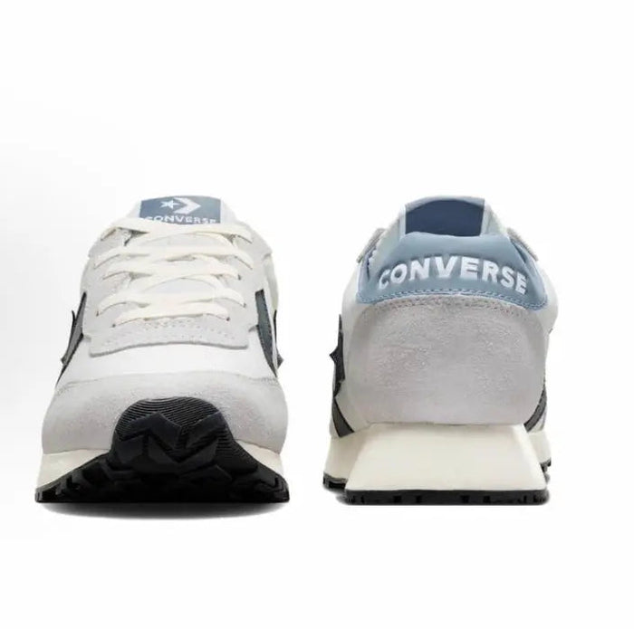 Back view of low-top lace-up sneakers in grey with navy heel tabs and tread sole