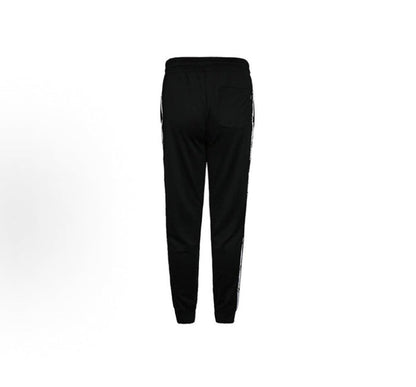 Black track pants with tapered fit and white side stripe on leg