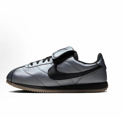 Nike low-top sneakers in grey with black Swoosh and black heel tab