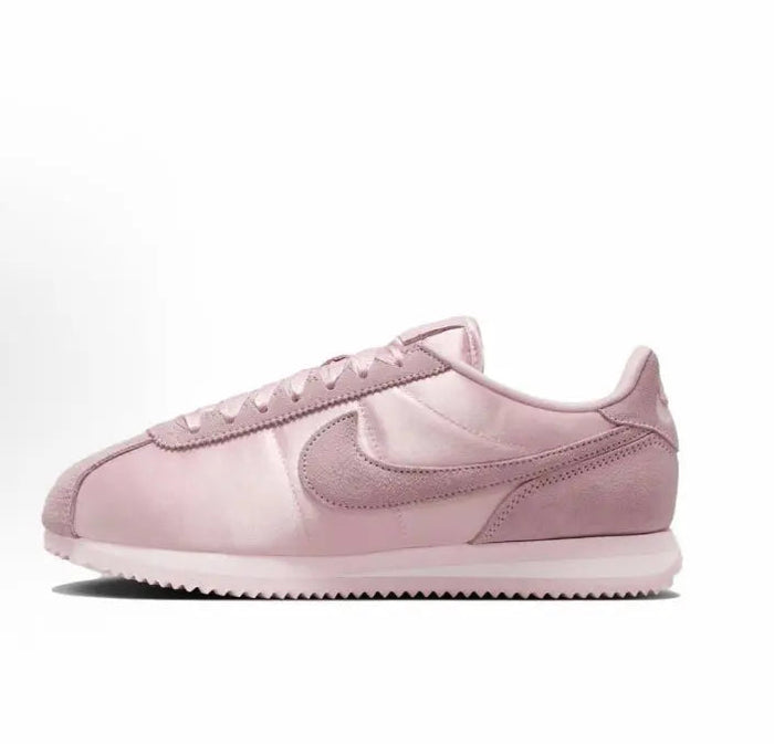 Pink Nike Cortez low-top sneakers with suede overlays and Swoosh logo