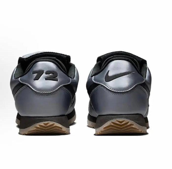 Nike low-top sneakers with grey uppers, black heel pull, and '72' back detail