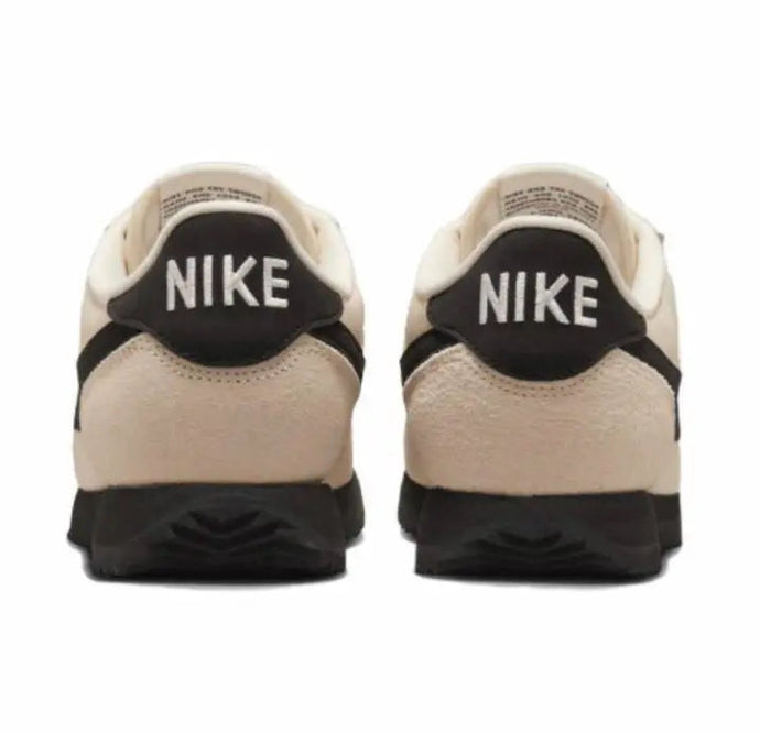 Nike Cortez sneakers heel view: NIKE logo on black heel counter