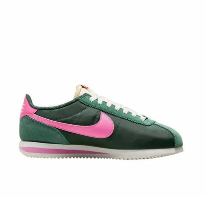 Nike Cortez low-top sneakers with pink swoosh, green upper, and white midsole