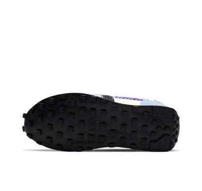 Nike Day Break sneaker outsole view with dark tread and blue details at the heel
