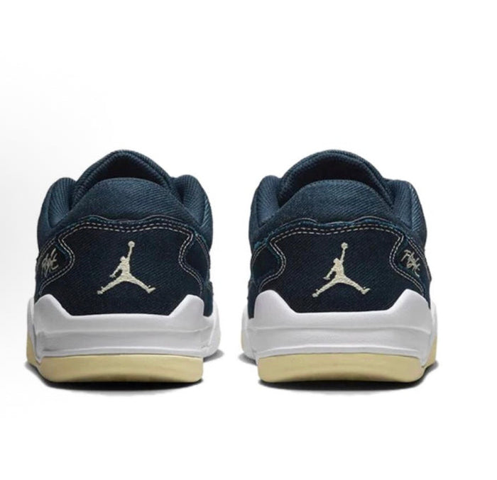 Navy low-top sneakers with heel branding and white midsole