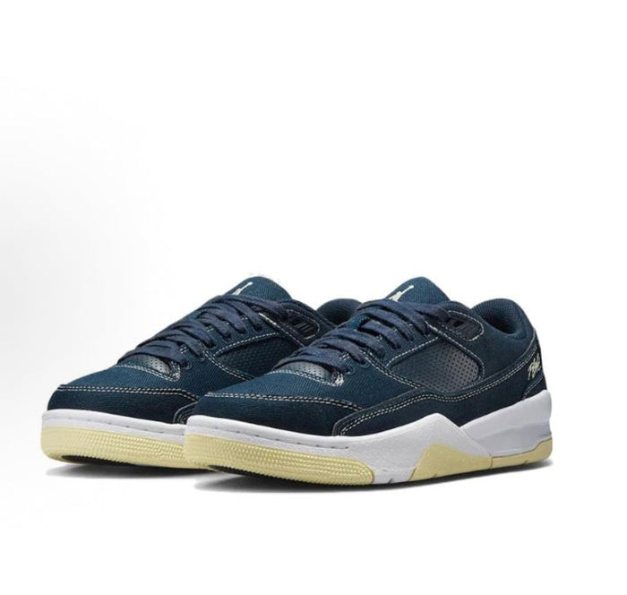 Navy low-top sneakers with lace-up front, white sole, and gum trim