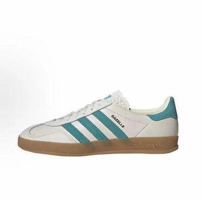 Adidas Gazelle low-top sneakers in white leather with teal stripes and gum rubber sole