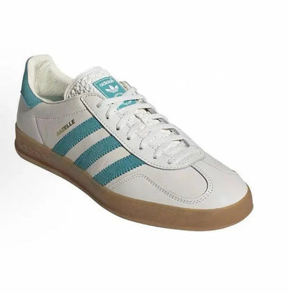Adidas Gazelle sneakers, white upper with teal three-stripe panel and brown gum sole