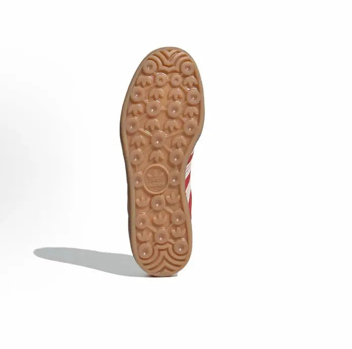 Gum rubber outsole for Adidas Gazelle Indoor sneaker with circular tread pattern.