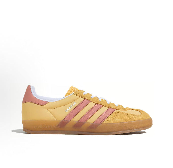 Gazelle Indoor sneakers side view, yellow suede with pink heel and three stripes