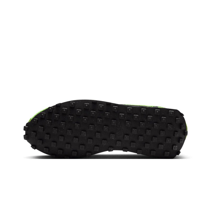 Green knit running sneakers with textured black outsole tread