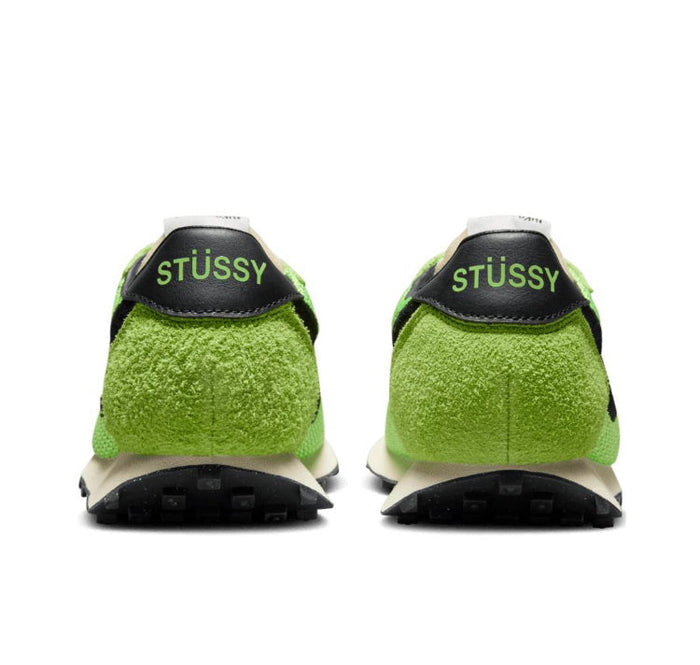 Pair of green knit sneakers with STUSSY heel patch and black outsole