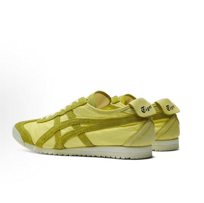 Light chartreuse low-top sneakers with heel tabs and stitched side stripe panels