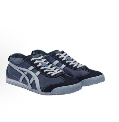 Mexico 66 NM sneakers angled view, dark blue uppers with white laces and stripe overlays