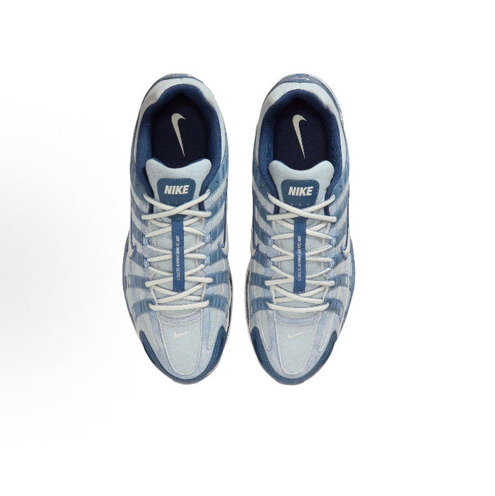 Pair of light blue Nike P-6000 sneakers, lace-up with Nike logo tongues