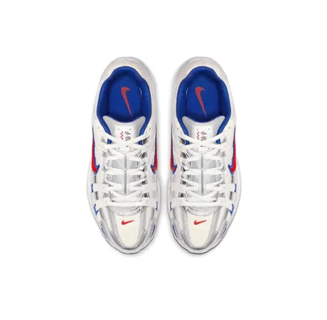 Premium running sneaker pair, white laces with blue tongue lining and red swoosh