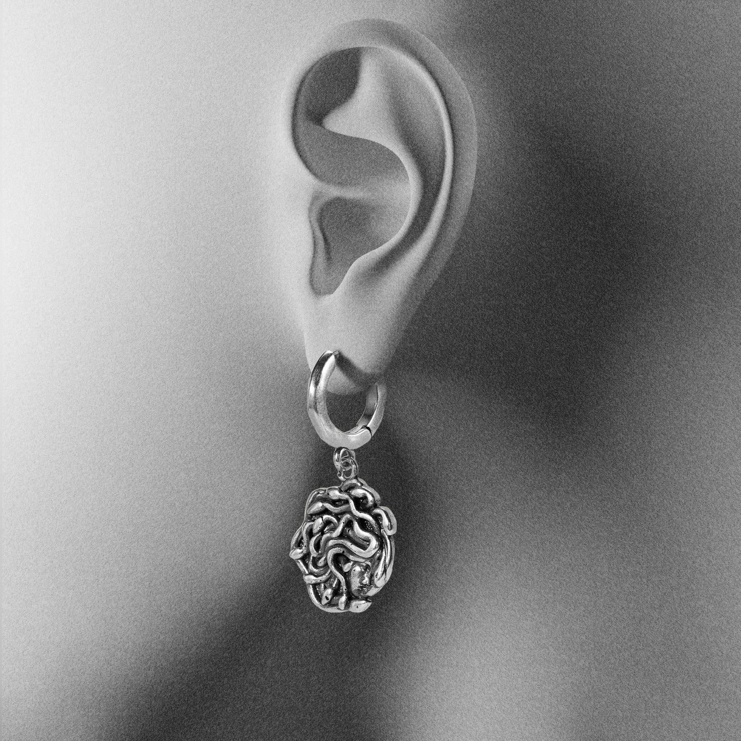 PETRIFYING GAZE DANGLE EARRINGS