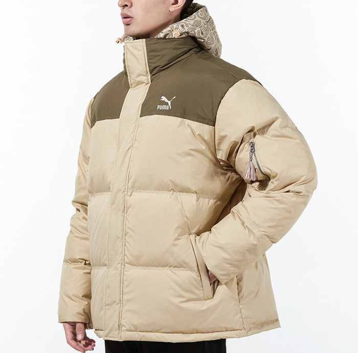 Puma tan puffer jacket side view with hood, logo, and sleeve zip pocket