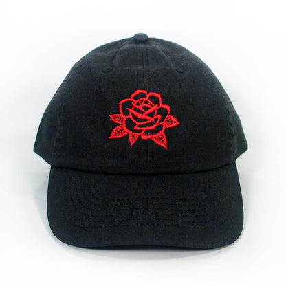 The I Am The Avalanche Rose Black Dad Hat features a beautifully embroidered red rose with leaves graphic on the front.