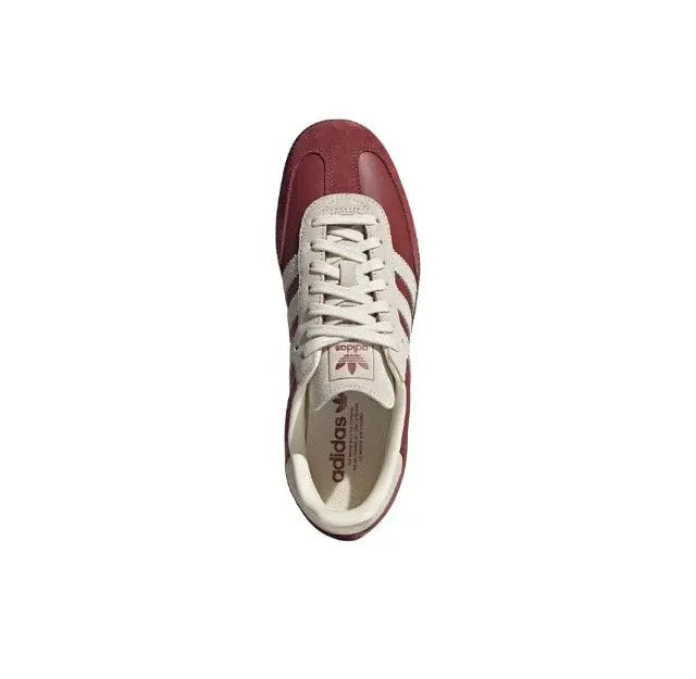 Adidas Samba OG sneakers with burgundy heel and white laces, side profile