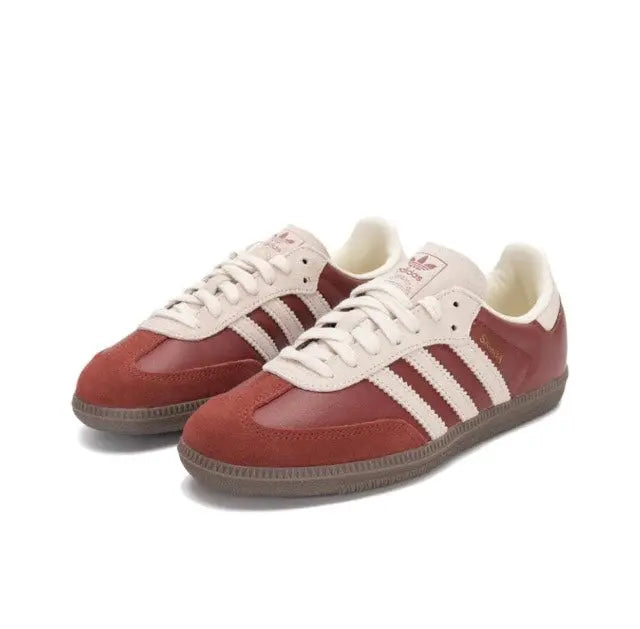 Adidas Samba OG sneakers pair in burgundy with white 3-Stripes and lace-up design