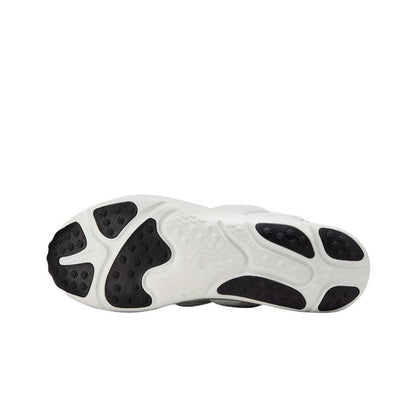 White rubber outsole with black traction pods and sculpted grooves