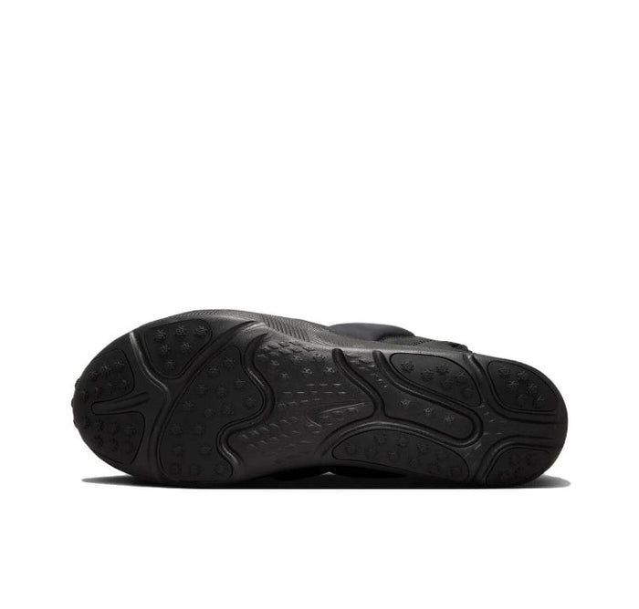 Black Nike sneaker outsole with textured tread and rubber traction pattern