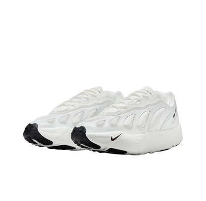 White low-top sneakers with Nike swoosh, stitched panels, and black toe caps
