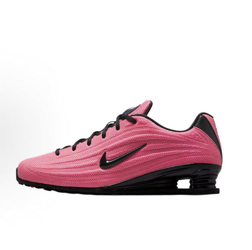 Pink and black running shoe with black swoosh and lace-up front