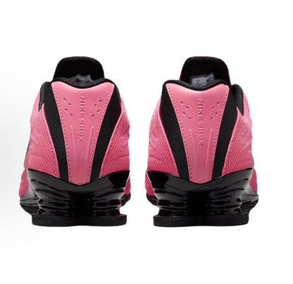 Pink and black running shoes rear view with black heel pods and pink panel