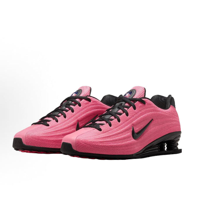 Pink and black running shoes side-by-side with black swoosh and Shox midsole