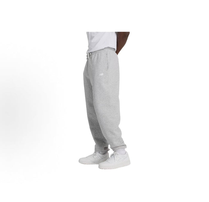 Grey fleece jogger pants, side view with small logo on thigh