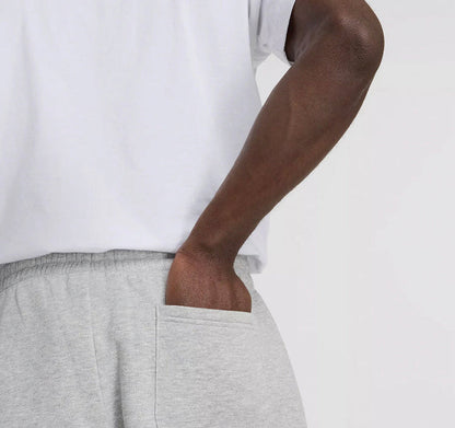Grey fleece jogger pants close-up of drawstring and waistband seam