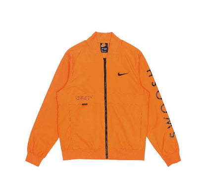 Orange Nike windbreaker jacket with full zip and black Swoosh on chest
